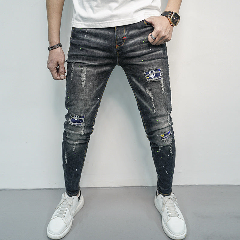 Herren Skinny Fit Jeans im kreativen Rissdesign und bunten Farbsklecks Stalluxe