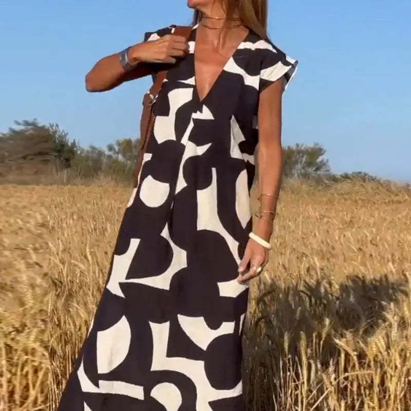 Damen lässiges Maxikleid mit kreativem Muster und tiefem V-Ausschnitt Stalluxe
