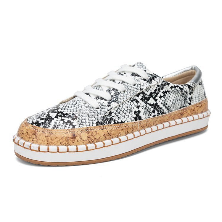 Damen Sneaker mit korkähnlicher Sohle und stylischem Schlangenmotiv Stalluxe