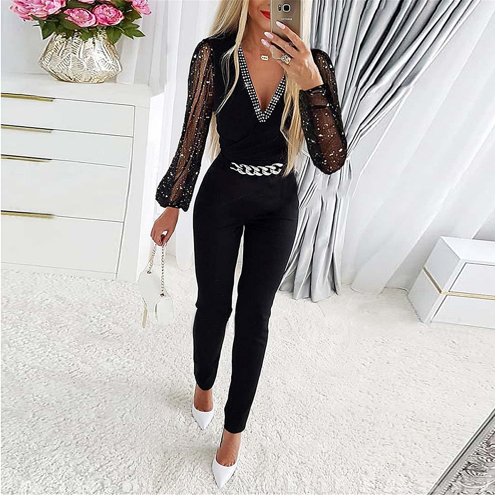 Damen Eleganter Jumpsuit mit transparenten Puffärmeln und Glitzerakzenten Stalluxe