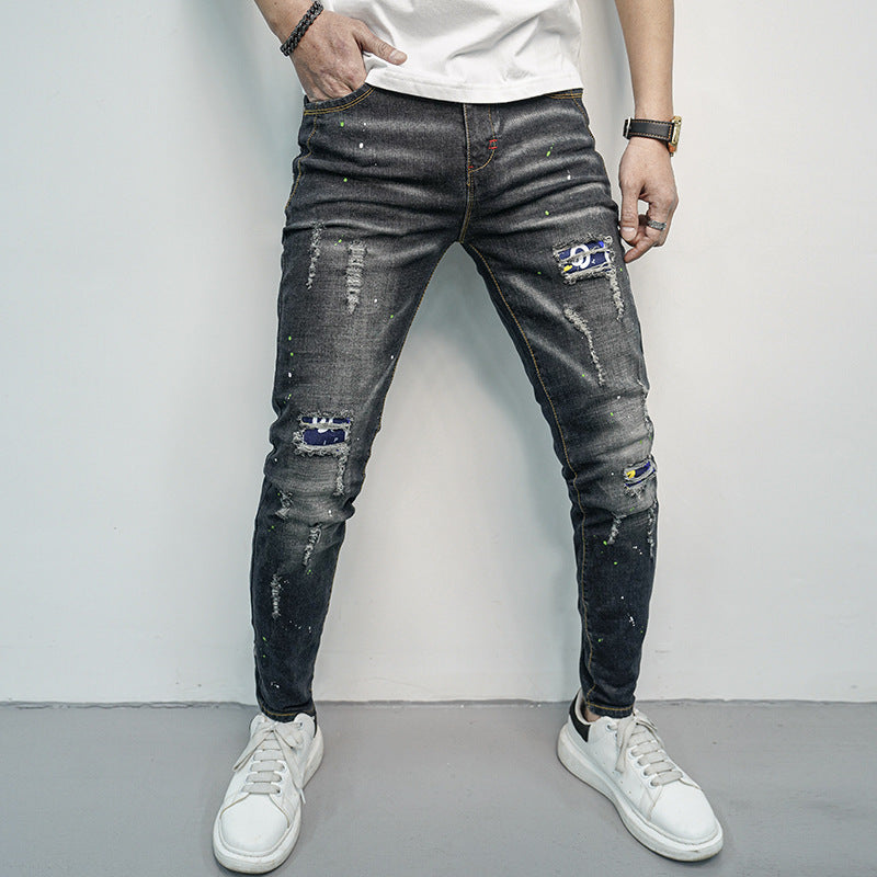 Herren Skinny Fit Jeans im kreativen Rissdesign und bunten Farbsklecks Stalluxe