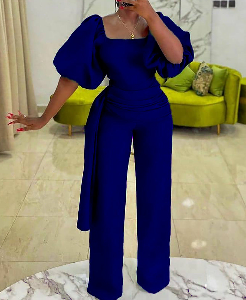 Damen eleganter Jumpsuit mit tailliertem Schnitt und voluminösen Puffärmeln Stalluxe