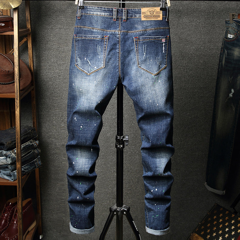 Herren Ripped Slim Fit Jeans mit kreativen Farbklecksen und modischem Destroyed-Look Stalluxe