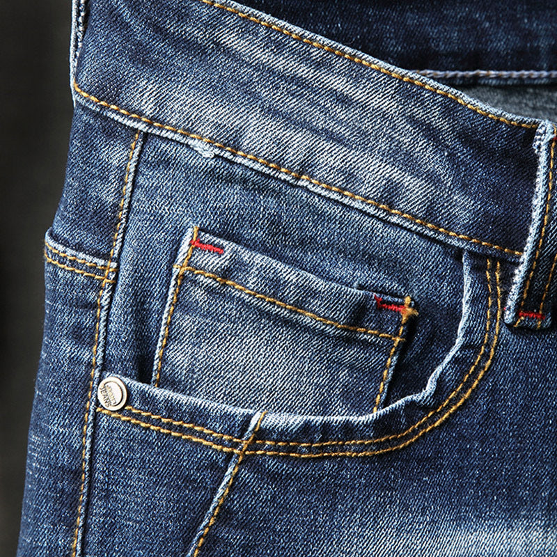 Herren Ripped Slim Fit Jeans mit kreativen Farbklecksen und modischem Destroyed-Look Stalluxe