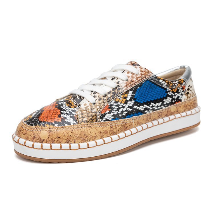 Damen Sneaker mit korkähnlicher Sohle und stylischem Schlangenmotiv Stalluxe