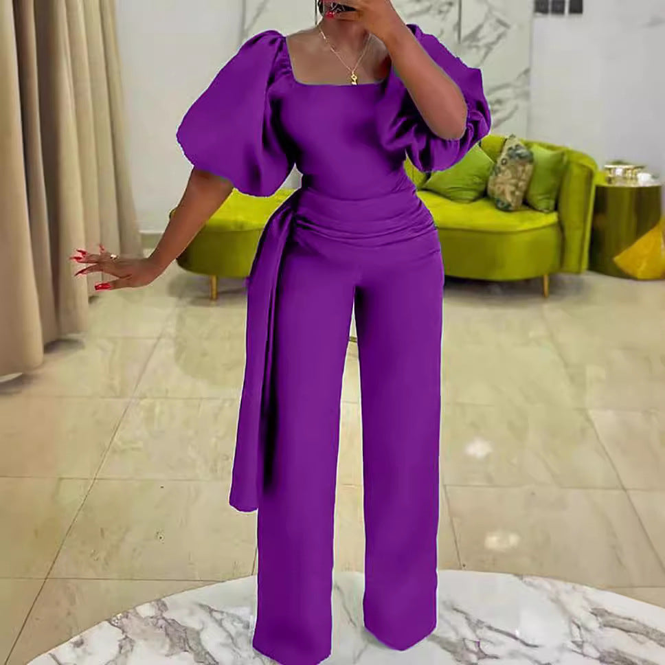 Damen eleganter Jumpsuit mit tailliertem Schnitt und voluminösen Puffärmeln Stalluxe