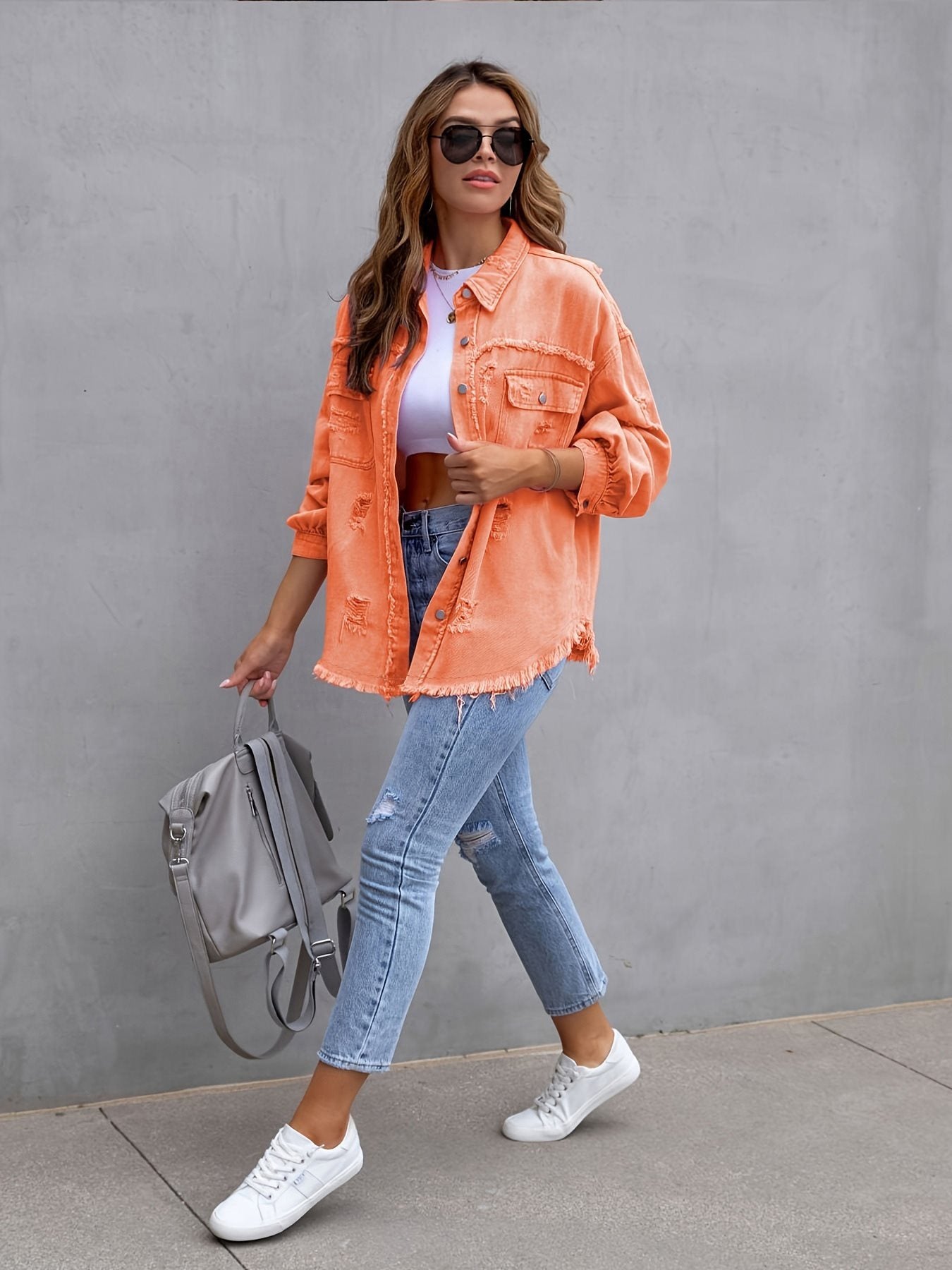 Damen oversized Jeansjacke mit fransigen Säumen und aufgesetzten Taschen Stalluxe