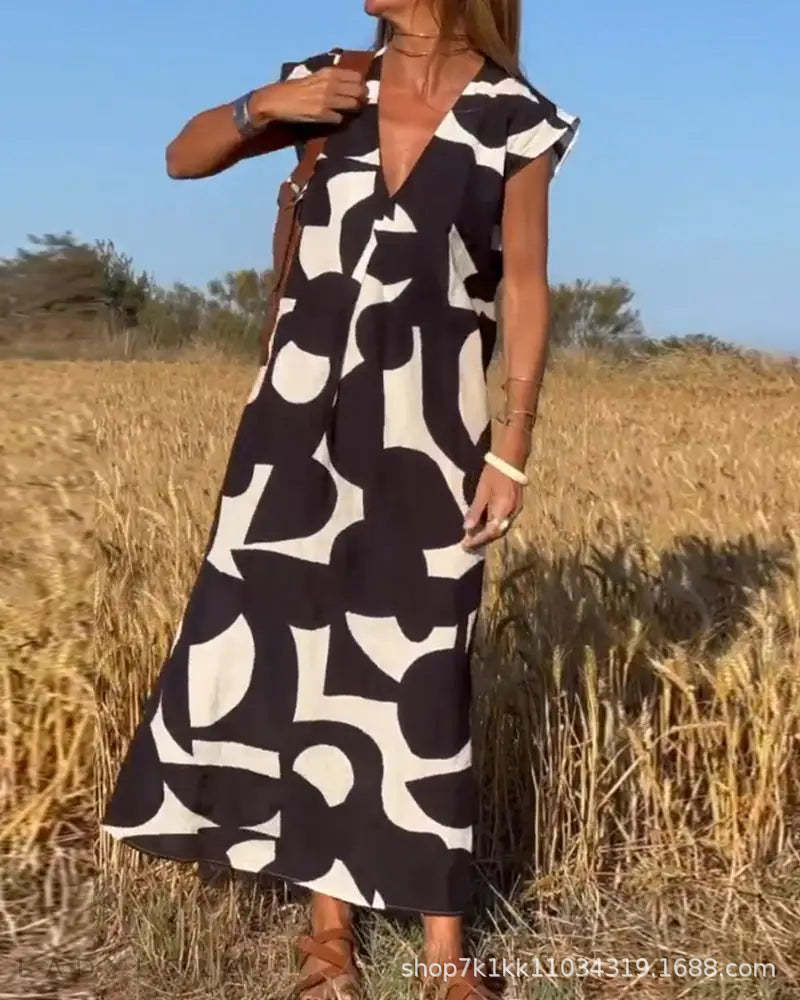 Damen lässiges Maxikleid mit kreativem Muster und tiefem V-Ausschnitt Stalluxe