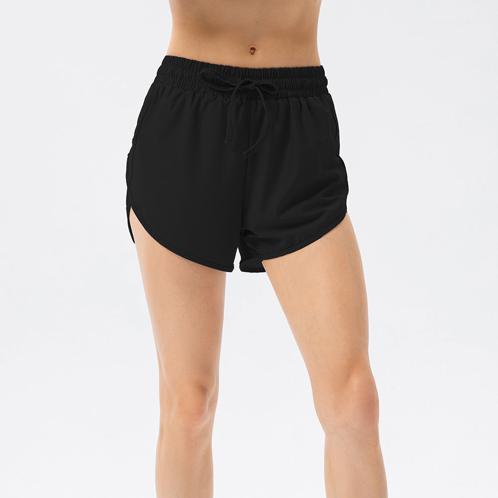 Damen Sportliche Laufshorts mit elastischem Bund und seitlichen Schlitzen Stalluxe