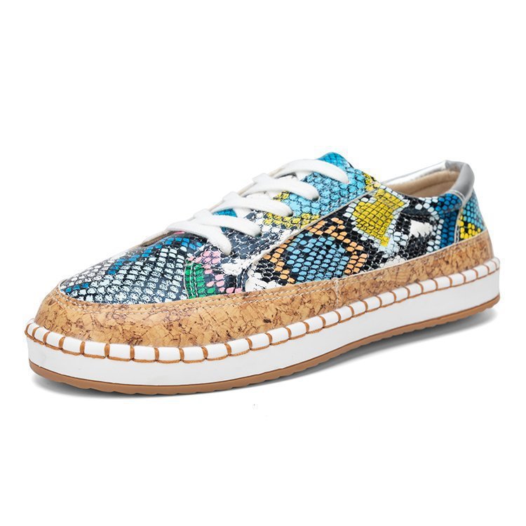 Damen Sneaker mit korkähnlicher Sohle und stylischem Schlangenmotiv Stalluxe