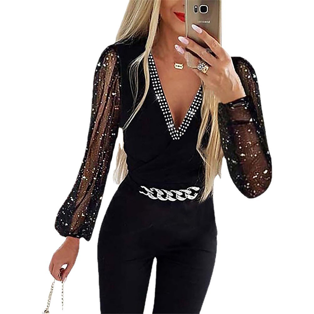 Damen Eleganter Jumpsuit mit transparenten Puffärmeln und Glitzerakzenten Stalluxe