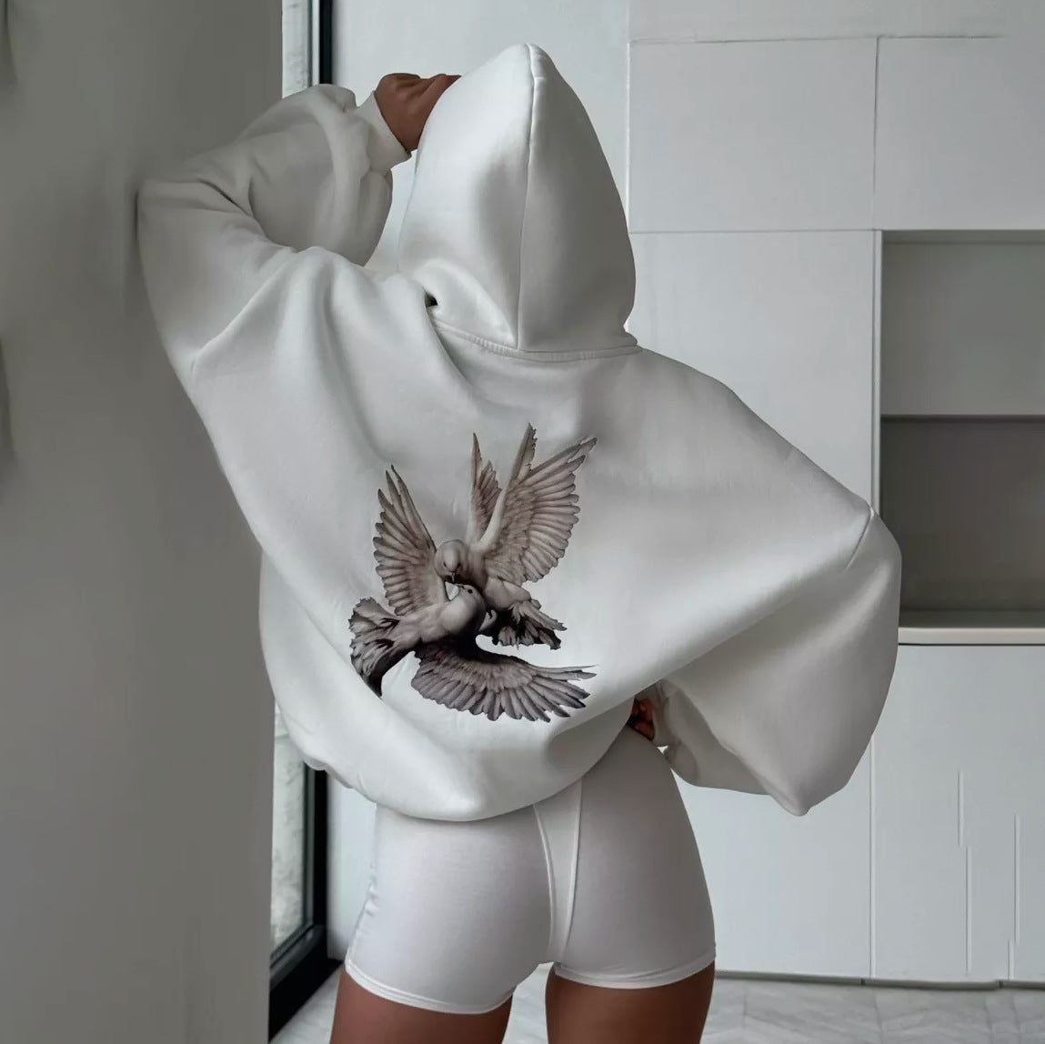 Damen Kapuzenpullover mit kreativem Vogelmotiv und lässigem Schnitt Stalluxe Weiß
