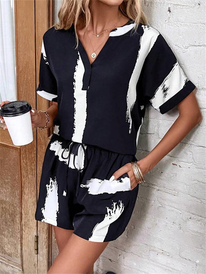 Damen modischer Kurz-Jumpsuit mit abstrakt gemustertem Oberteil und elastischem Bund Stalluxe