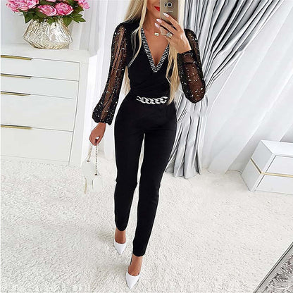 Damen Eleganter Jumpsuit mit transparenten Puffärmeln und Glitzerakzenten Stalluxe