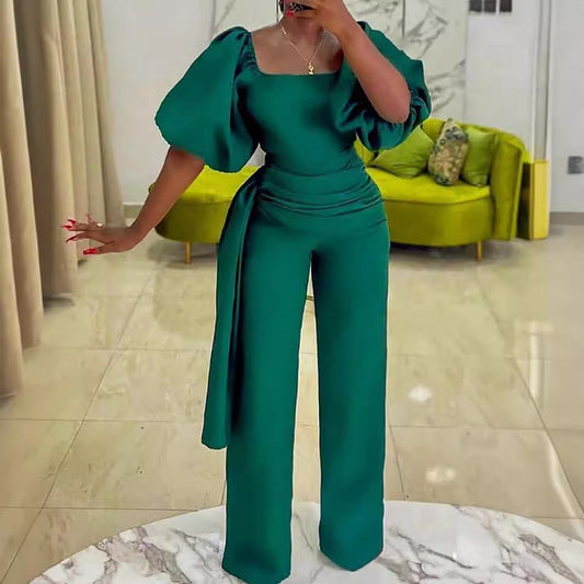 Damen eleganter Jumpsuit mit tailliertem Schnitt und voluminösen Puffärmeln Stalluxe