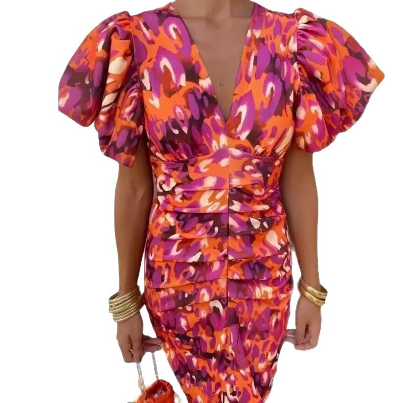 Damen Wickelkleid mit extravaganten Puffärmeln und lebhaftem Muster Stalluxe