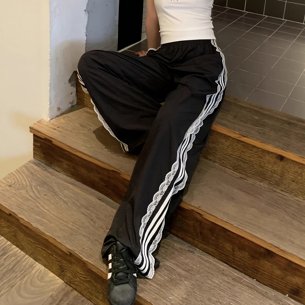 Damen lockere Sporthose mit praktischen Seitentaschen und dekorativen Streifen Stalluxe