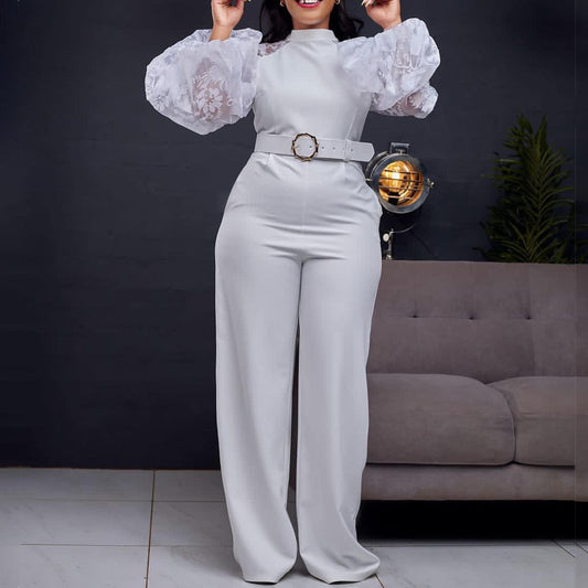 Damen Eleganter Jumpsuit mit transparenten Puffärmeln und tailliertem Gürtel Stalluxe