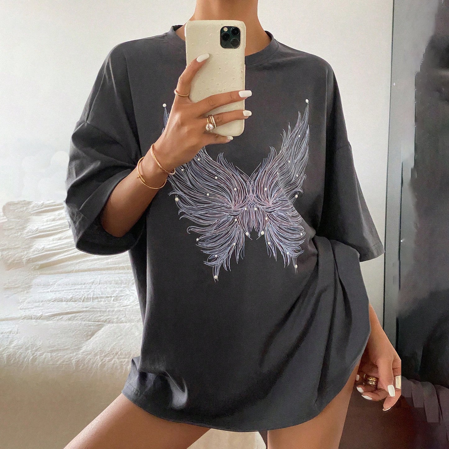 Damen oversized T-Shirt mit kreativem Federmotiv Stalluxe