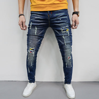 Herren Skinny Fit Jeans mit kreativen Farbklecksen und Rissdesign Stalluxe