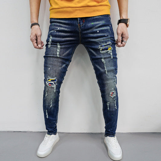 Herren Skinny Fit Jeans mit kreativen Farbklecksen und Rissdesign Stalluxe