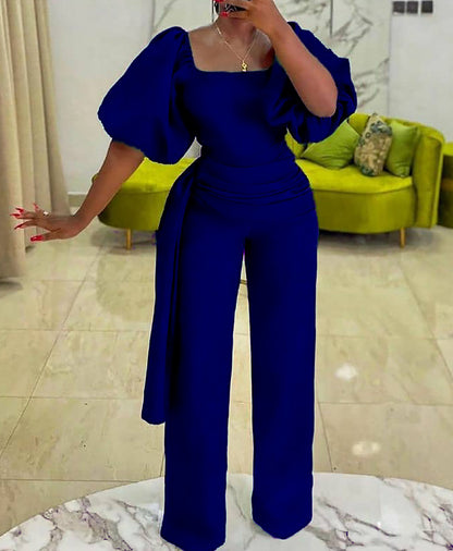 Damen eleganter Jumpsuit mit tailliertem Schnitt und voluminösen Puffärmeln Stalluxe