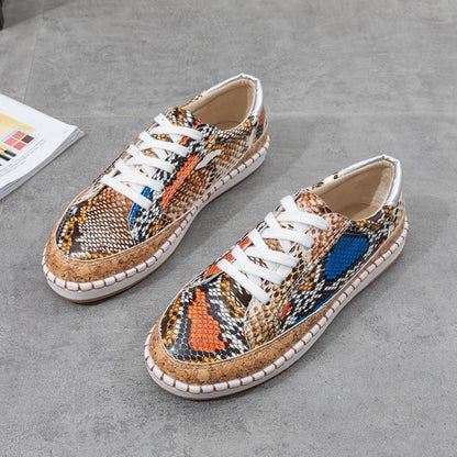 Damen Sneaker mit korkähnlicher Sohle und stylischem Schlangenmotiv Stalluxe