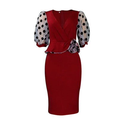 Damen Wickelkleid mit voluminösen Puffärmeln und floralen Akzenten Stalluxe