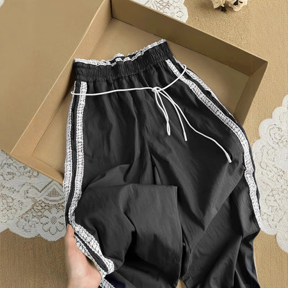 Damen lockere Sporthose mit praktischen Seitentaschen und dekorativen Streifen Stalluxe