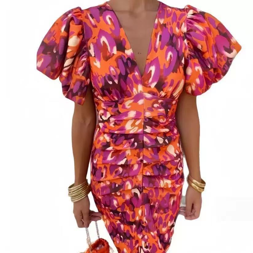 Damen Wickelkleid mit extravaganten Puffärmeln und lebhaftem Muster Stalluxe