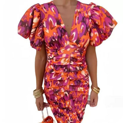 Damen Wickelkleid mit extravaganten Puffärmeln und lebhaftem Muster Stalluxe