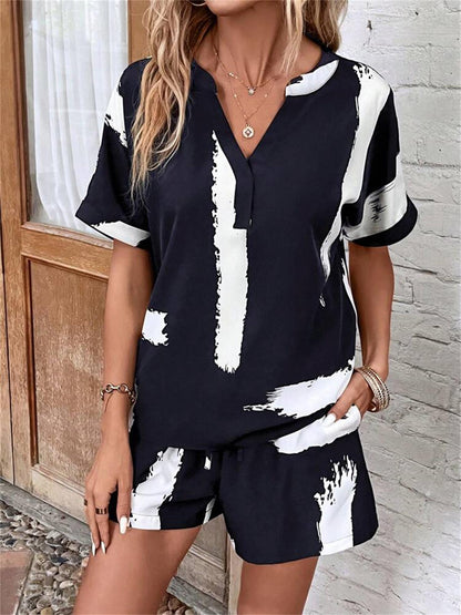 Damen modischer Kurz-Jumpsuit mit abstrakt gemustertem Oberteil und elastischem Bund Stalluxe