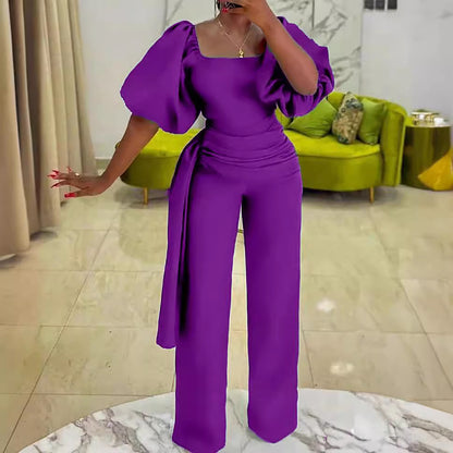 Damen eleganter Jumpsuit mit tailliertem Schnitt und voluminösen Puffärmeln Stalluxe