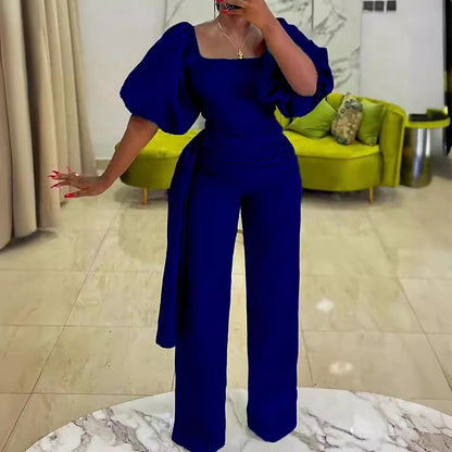 Damen eleganter Jumpsuit mit tailliertem Schnitt und voluminösen Puffärmeln Stalluxe