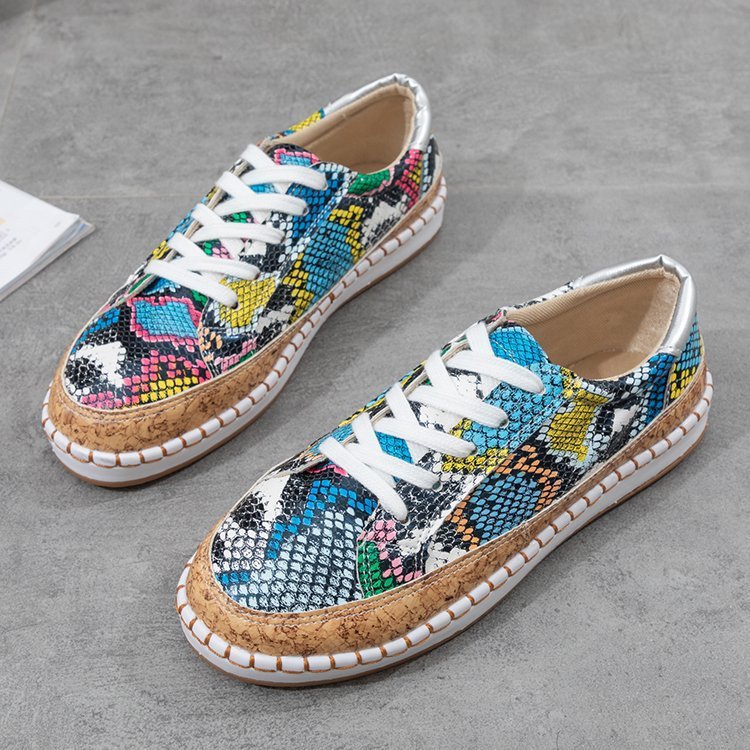 Damen Sneaker mit korkähnlicher Sohle und stylischem Schlangenmotiv Stalluxe
