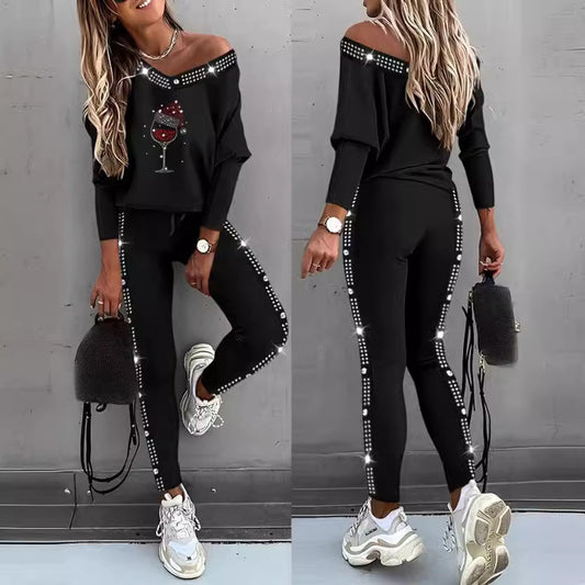 Damen Freizeit Set mit glitzerndem Motiv und offenem Schulterdesign Stalluxe