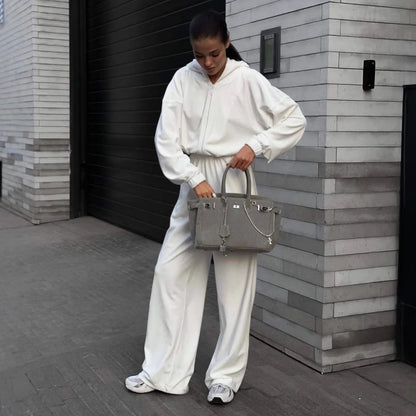 Damen Lässiger Fleece-Jumpsuit mit Kapuze und praktischen Taschen Stalluxe