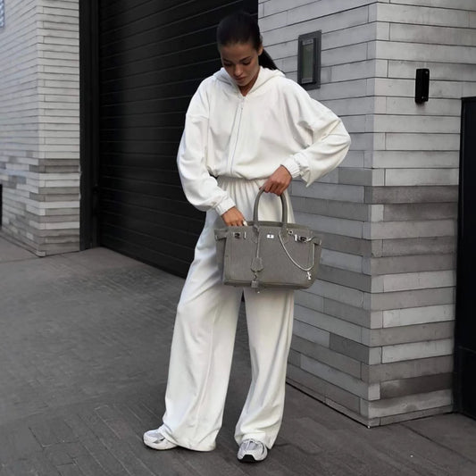 Damen Lässiger Fleece-Jumpsuit mit Kapuze und praktischen Taschen Stalluxe
