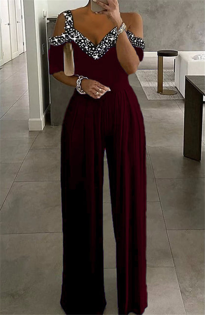 Damen eleganter Jumpsuit mit schulterfreier Gestaltung und glitzerndem Dekolleté Stalluxe