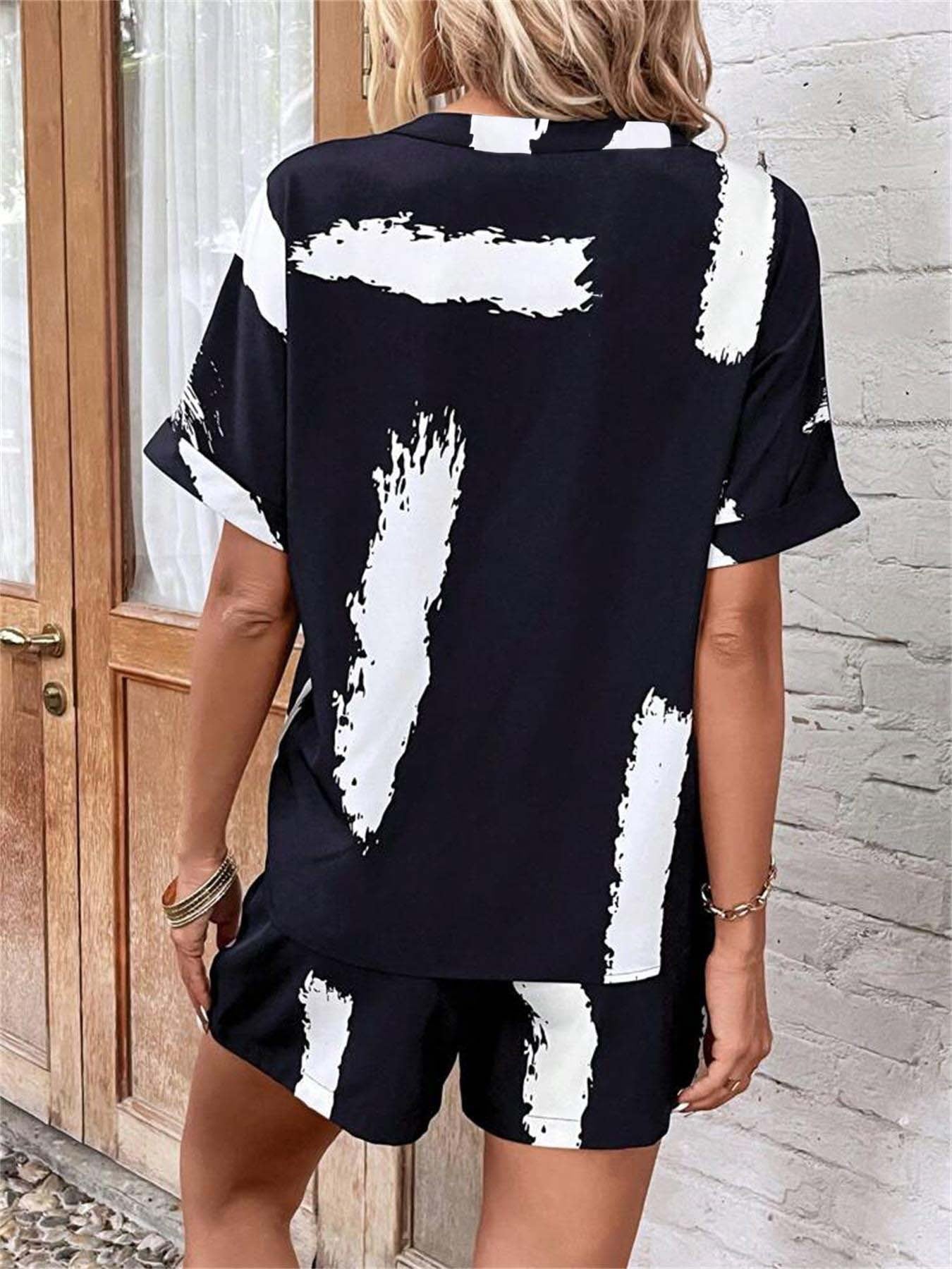 Damen modischer Kurz-Jumpsuit mit abstrakt gemustertem Oberteil und elastischem Bund Stalluxe