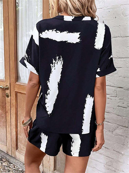 Damen modischer Kurz-Jumpsuit mit abstrakt gemustertem Oberteil und elastischem Bund Stalluxe