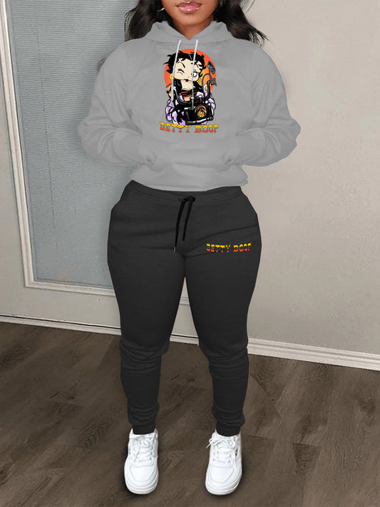 Damen modernes Kapuzenpullover und lässige Jogginghose Set mit künstlerischem Cartoon-Druck Stalluxe